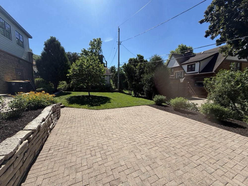 Completed green lawn with mulch beds and flowers in Milwaukee