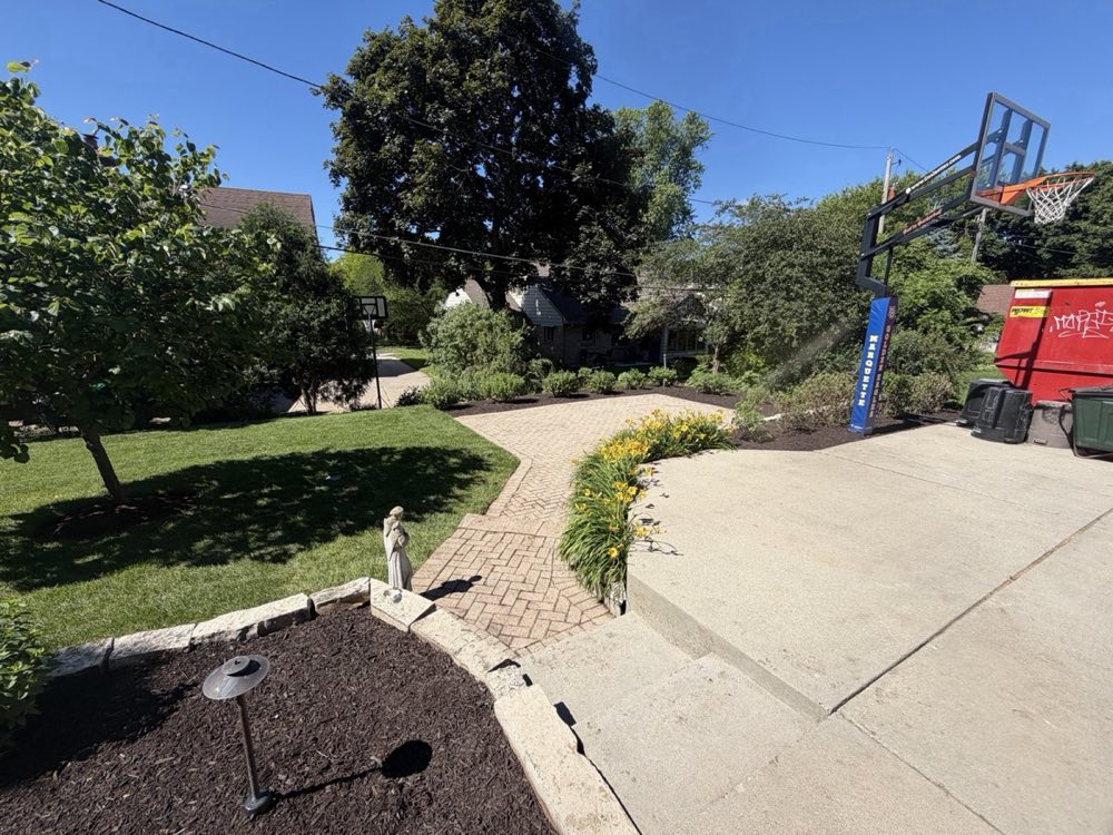 Finished front yard with day lilies and paver walkway